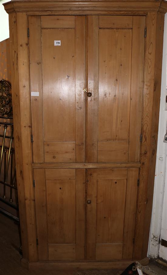 A 19th century pine standing corner cupboard